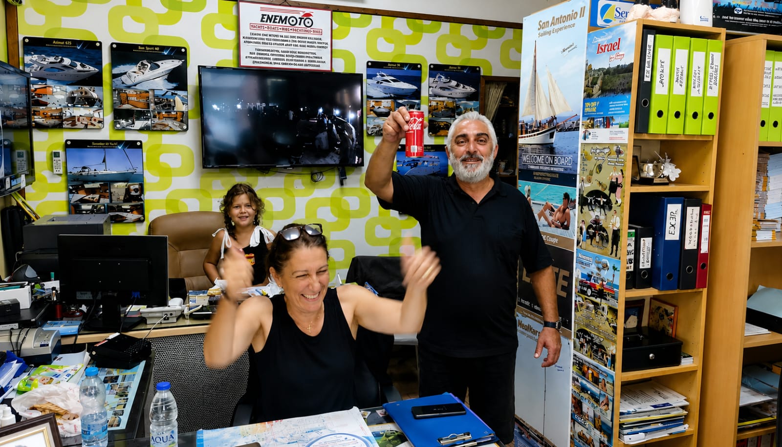 The Kannias family celebrating at the office desk