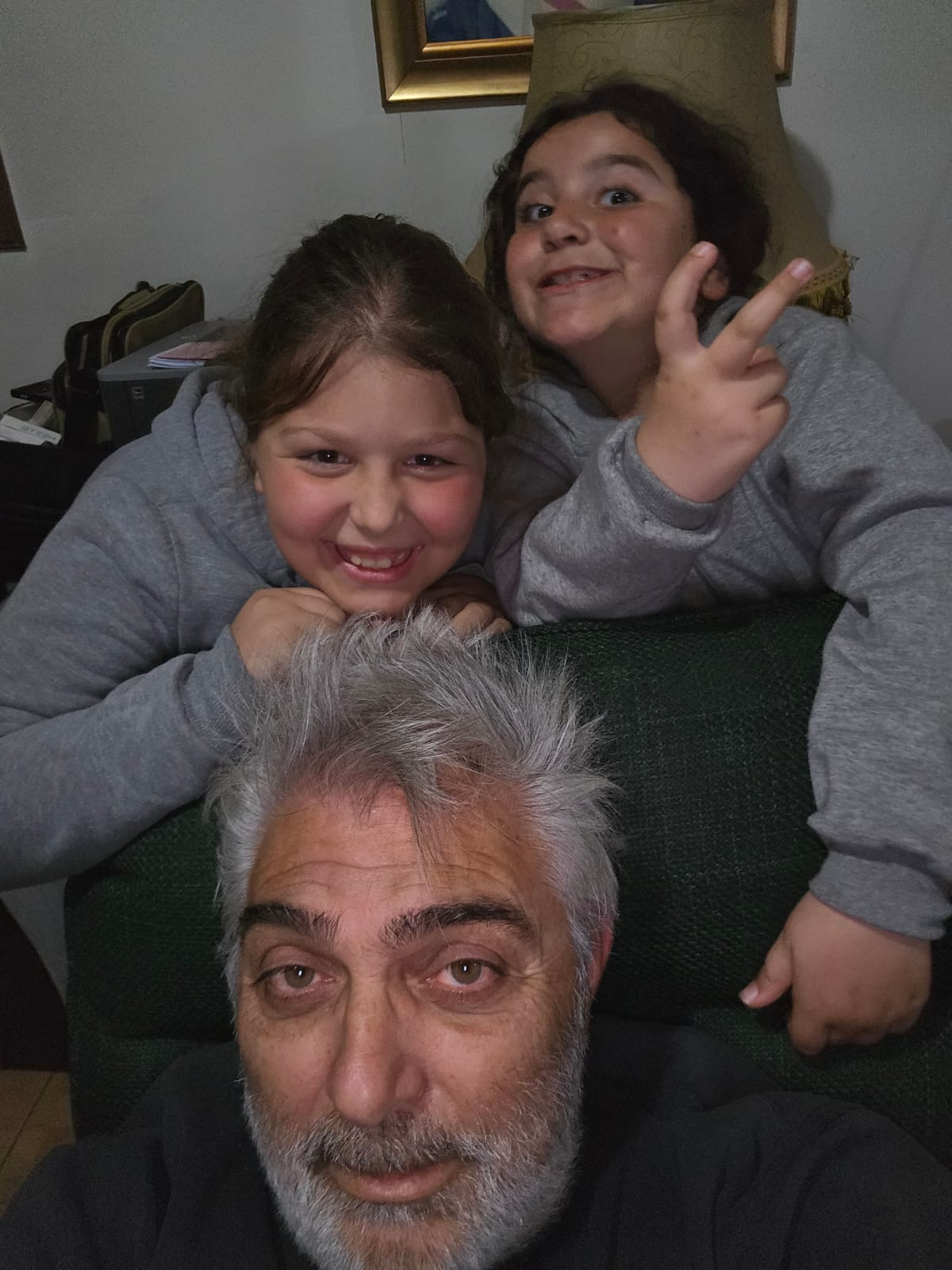 Nikos with family in a casual selfie